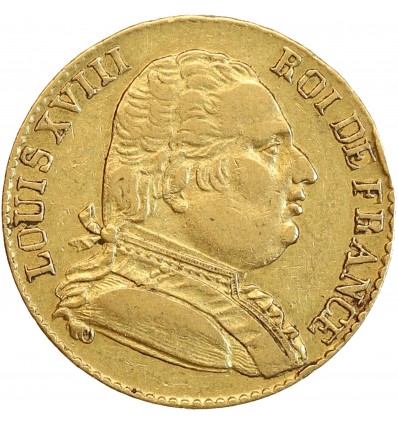 Avers : buste de Louis XVIII à droite, habillé avec le cordon de l'Ordre du Saint-Esprit