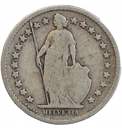 Avers : Helvetia debout vêtue d'une toge, appuyée contre un bouclier et tenant une lance