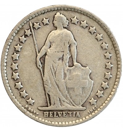 Avers : Helvetia debout vêtue d'une toge, appuyée contre un bouclier et tenant une lance
