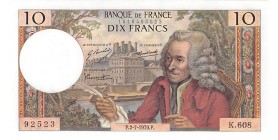 Avers : au premier plan un portrait de Voltaire, en fond le palais des Tuileries