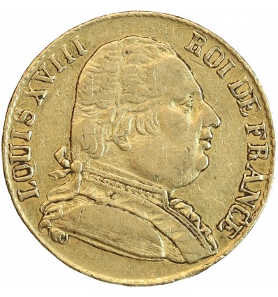 Avers : buste de Louis XVIII à droite, habillé avec le cordon de l'Ordre du Saint-Esprit