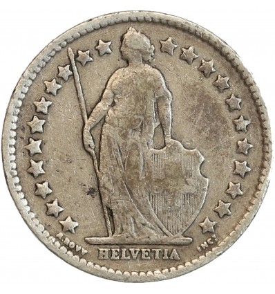 Avers : Helvetia debout vêtue d'une toge, appuyée contre un bouclier et tenant une lance