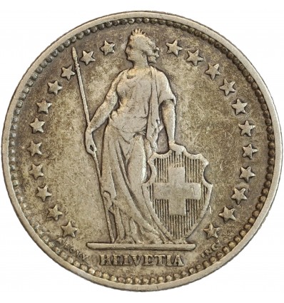 Avers : Helvetia debout vêtue d'une toge, appuyée contre un bouclier et tenant une lance