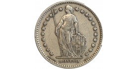 Avers : Helvetia debout vêtue d'une toge, appuyée contre un bouclier et tenant une lance