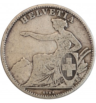 Avers : Helvetia debout vêtue d'une toge, appuyée contre un bouclier et tenant une lance