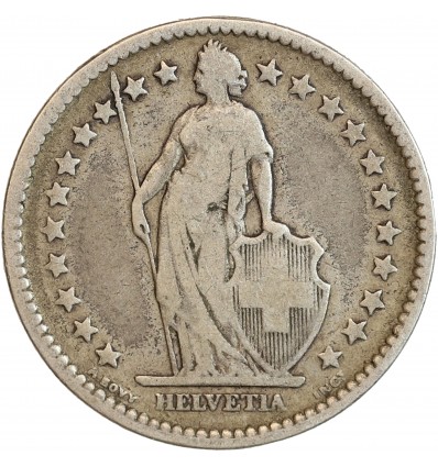 Avers : Helvetia debout vêtue d'une toge, appuyée contre un bouclier et tenant une lance