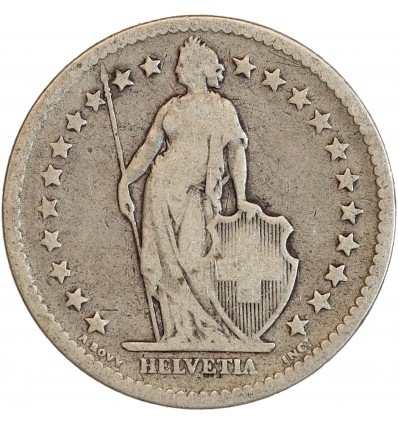 Avers : Helvetia debout vêtue d'une toge, appuyée contre un bouclier et tenant une lance