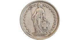 Avers : Helvetia debout vêtue d'une toge, appuyée contre un bouclier et tenant une lance