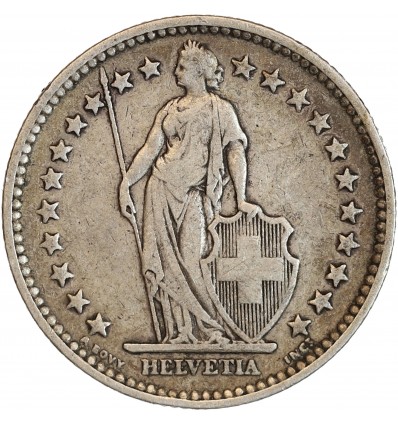 Avers : Helvetia debout vêtue d'une toge, appuyée contre un bouclier et tenant une lance