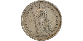 Avers : Helvetia debout vêtue d'une toge, appuyée contre un bouclier et tenant une lance