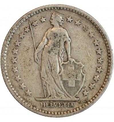 Avers : Helvetia debout vêtue d'une toge, appuyée contre un bouclier et tenant une lance