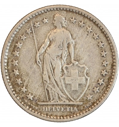 Avers : Helvetia debout vêtue d'une toge, appuyée contre un bouclier et tenant une lance