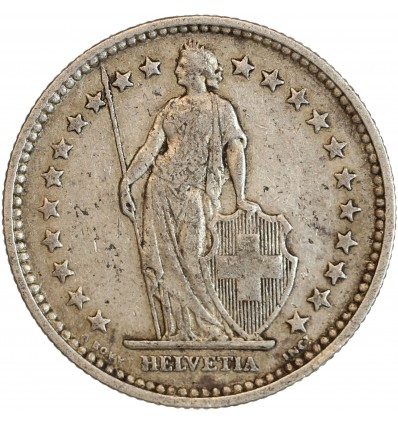 Avers : Helvetia debout vêtue d'une toge, appuyée contre un bouclier et tenant une lance