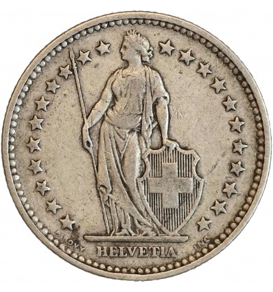 Avers : Helvetia debout vêtue d'une toge, appuyée contre un bouclier et tenant une lance