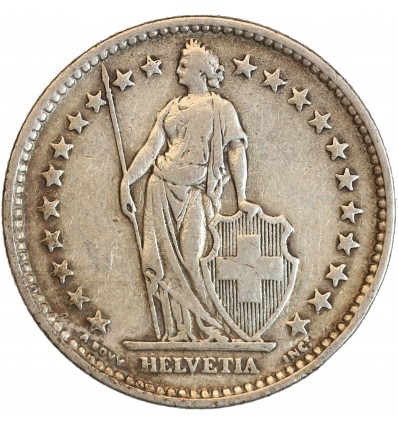 Avers : Helvetia debout vêtue d'une toge, appuyée contre un bouclier et tenant une lance