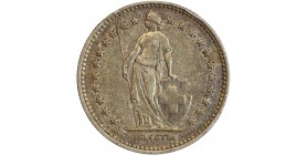 Avers : Helvetia debout vêtue d'une toge, appuyée contre un bouclier et tenant une lance