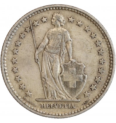 Avers : Helvetia debout vêtue d'une toge, appuyée contre un bouclier et tenant une lance