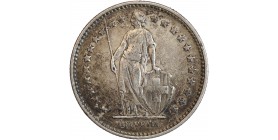 Avers : Helvetia debout vêtue d'une toge, appuyée contre un bouclier et tenant une lance