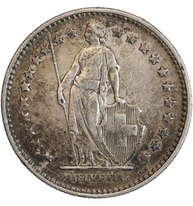 Avers : Helvetia debout vêtue d'une toge, appuyée contre un bouclier et tenant une lance