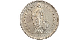 Avers : Helvetia debout vêtue d'une toge, appuyée contre un bouclier et tenant une lance