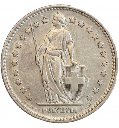 Avers : Helvetia debout vêtue d'une toge, appuyée contre un bouclier et tenant une lance