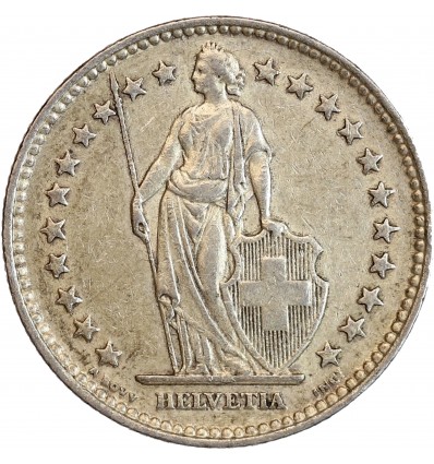 Avers : Helvetia debout vêtue d'une toge, appuyée contre un bouclier et tenant une lance