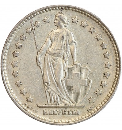 Avers : Helvetia debout vêtue d'une toge, appuyée contre un bouclier et tenant une lance