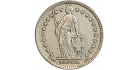 Avers : Helvetia debout vêtue d'une toge, appuyée contre un bouclier et tenant une lance