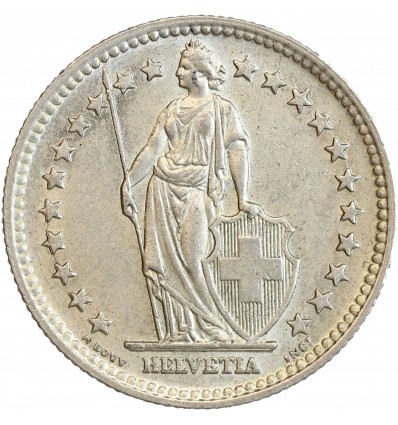 Avers : Helvetia debout vêtue d'une toge, appuyée contre un bouclier et tenant une lance