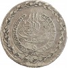 Avers : Toughra entourée d'un motif décoratif et d'une couronne végétale.