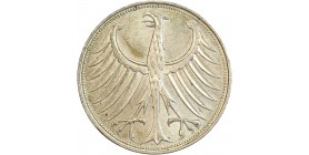 Avers : un aigle aux ailes déployées.