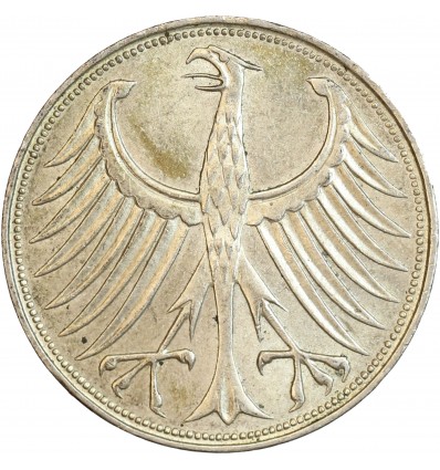 Avers : un aigle aux ailes déployées.