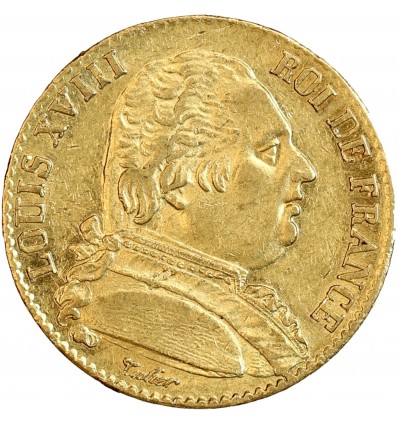 Avers : buste de Louis XVIII à droite, habillé avec le cordon de l'Ordre du Saint-Esprit