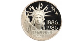 Avers : statue de la Liberté vue de face entourée d'un vol d'oiseaux