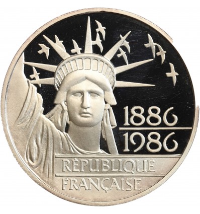 Avers : statue de la Liberté vue de face entourée d'un vol d'oiseaux