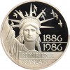 Avers : statue de la Liberté vue de face entourée d'un vol d'oiseaux
