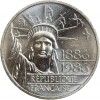 Avers : statue de la Liberté vue de face entourée d'un vol d'oiseaux