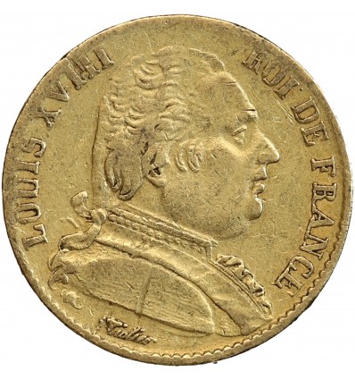 Avers : buste de Louis XVIII à droite, habillé avec le cordon de l'Ordre du Saint-Esprit