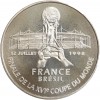 Revers : le trophée présenté avec le stade de France en arrière-plan