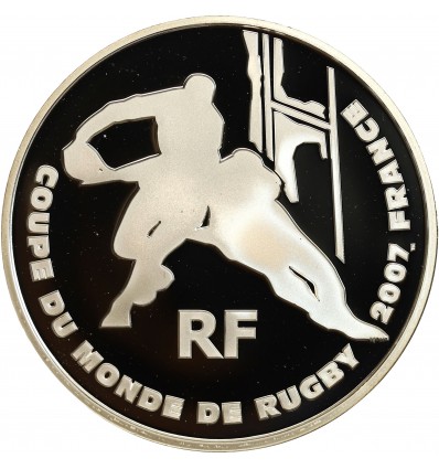 Avers : sylhouettes stylisées de deux joueurs de rugby devant les poteaux d'un terrain de rugby